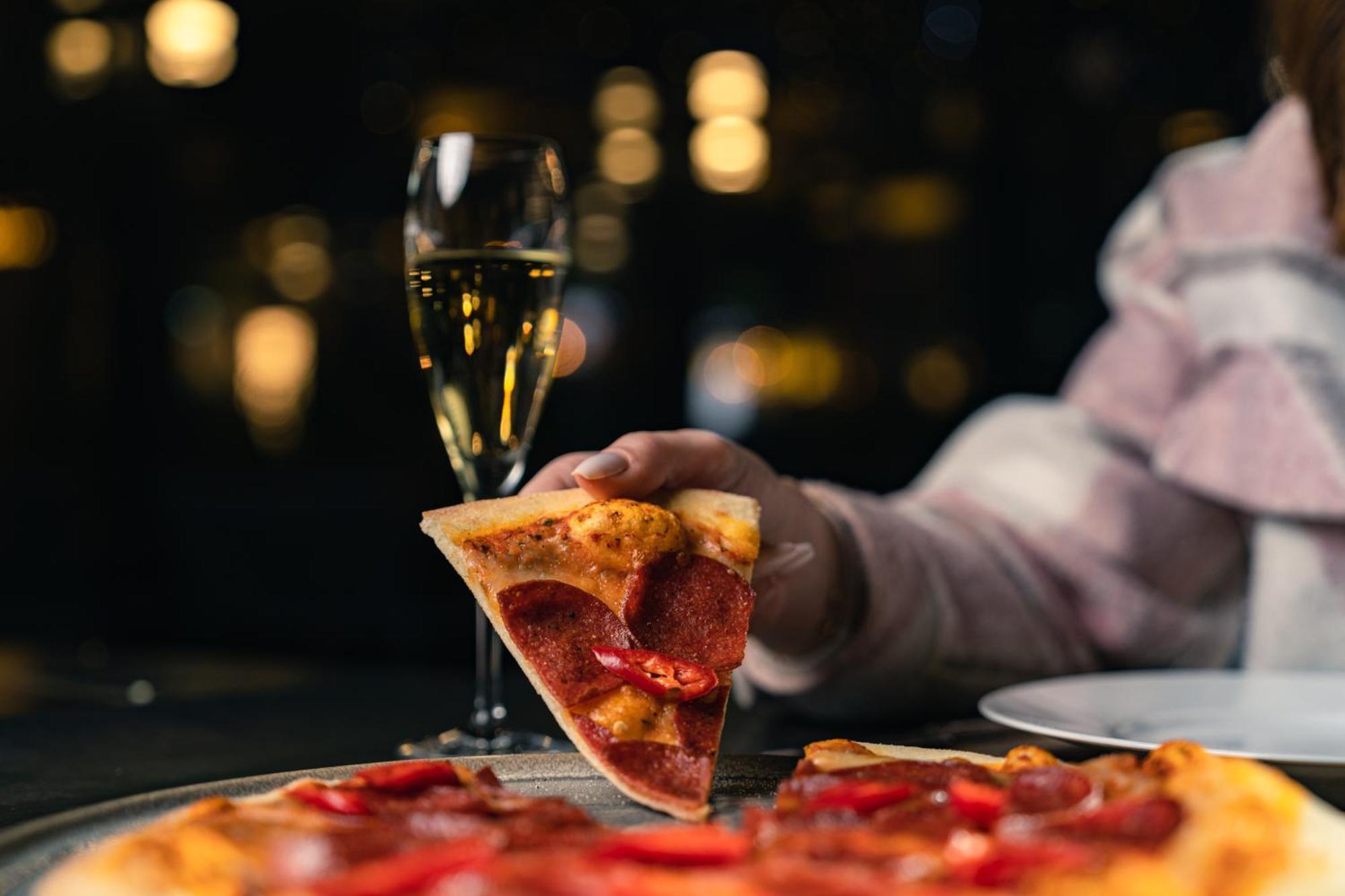 The Abdali Boulevard Hotel Amman Exterior photo A slice of pizza